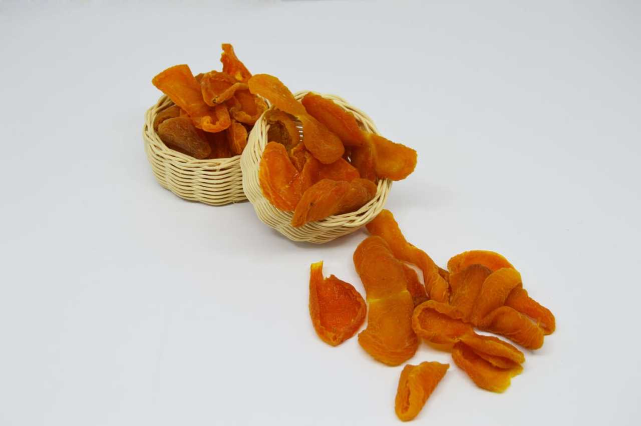 Dried sour yellow apricots from Nazlikoy, 500 grams, showing textured, yellow-orange dried apricots with natural surface details.