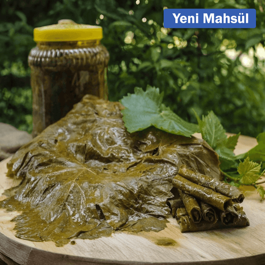 Fresh salamura yaprak (pickled grape leaves) from Nazlikoy, showing neatly packed grape leaves ready for cooking or stuffing.